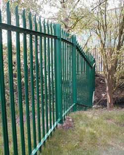 Green PVC coated palisade fencing is installed to protect premises.